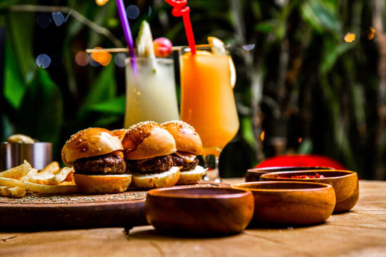 mini burgers french fries spices cocktails side view